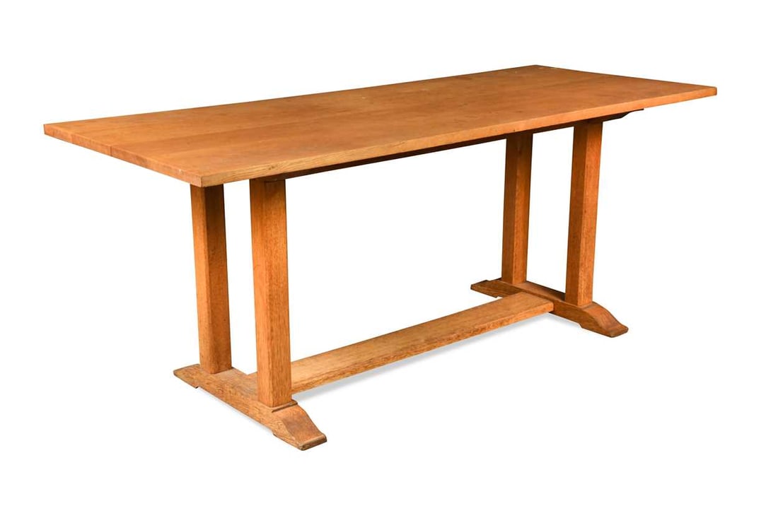 A Heal's oak refectory dining table, the rectangular top raised on four chamfered square supports (1 of 1)
