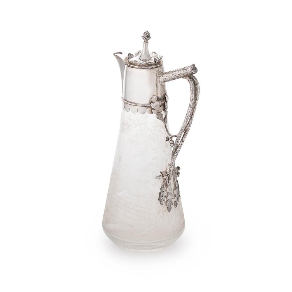 A Victorian silver mounted glass claret jug, mark of Elkington & Company (Frederick Elkington),: A Victorian silver mounted glass claret jug, mark of Elkington & Company (Frederick Elkington), Birmingham 1878, the tapering circular body acid etched with a hunting scene in the countryside, silver