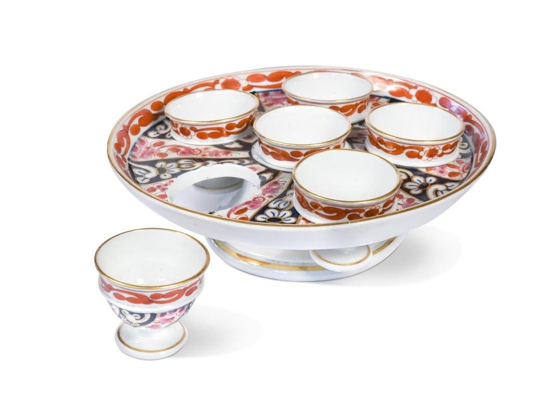 A Worcester, Flight and Barr egg cup stand for six egg cups, circa 1800,: A Worcester, Flight and Barr egg cup stand for six egg cups, circa 1800, decorated in the 'Queen Charlotte' pattern, 20.5cm diameter