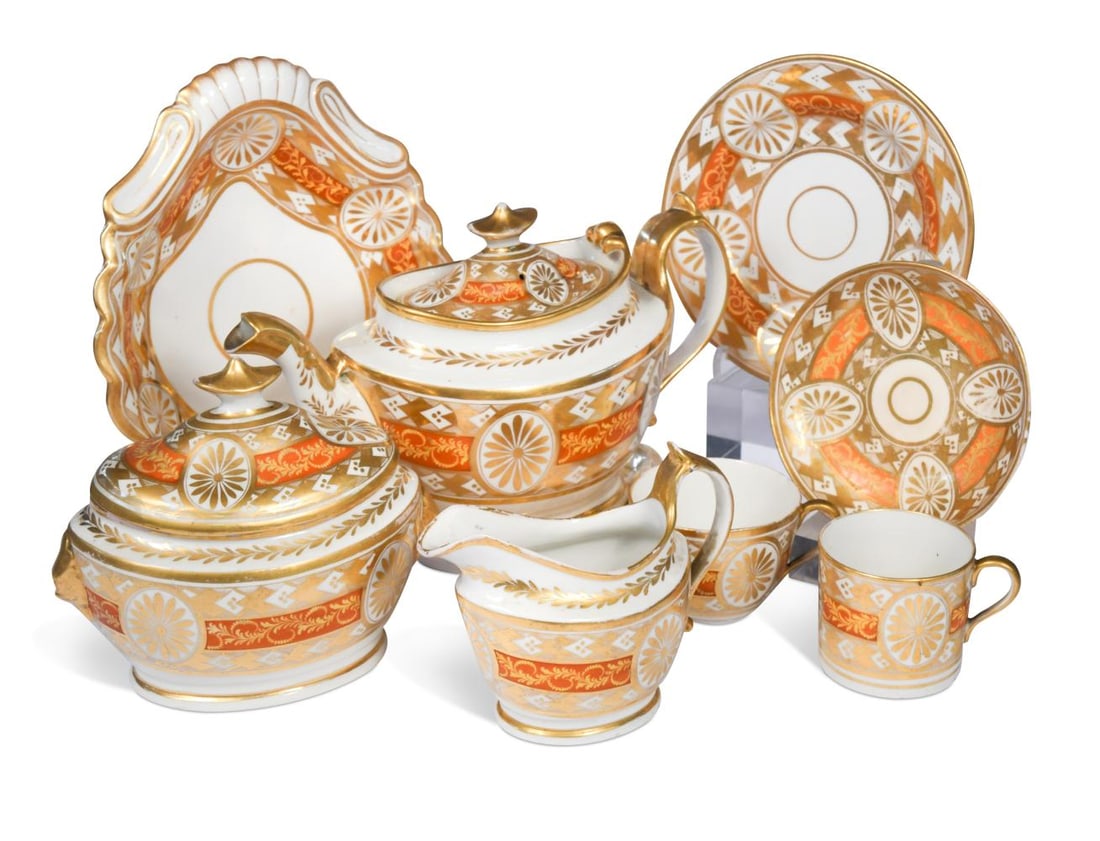 A composed Spode and Coalport tea and coffee service, circa 1805,: A composed Spode and Coalport tea and coffee service, circa 1805, decorated with gilt oval paterae and reserved on a broad border of overlapping gilt diamonds and an orange band, comprising a teapot, 