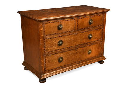 Shapland & Petter, Barnstaple, an Arts & Crafts oak chest of drawers,: Shapland & Petter, Barnstaple, an Arts & Crafts oak chest of drawers, the rectangular top with chequered cross-banding above two short and two long drawers with chevron cross-banding, and fitted with