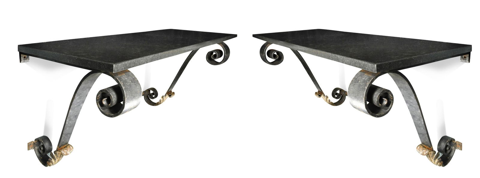 A pair of blacksmith-made wrought iron console tables,: A pair of blacksmith-made wrought iron console tables, each with rectangular polished black granite tops raised on scrolled supports incorporating a still-leaf motif 52 x 100 x 36cm All in super condi
