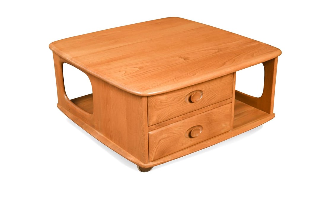 An Ercol elm 'Pandora's Box' coffee table, model 735,: An Ercol elm 'Pandora's Box' coffee table, model 735, incorporating two drawers 39 x 80 x 80cm