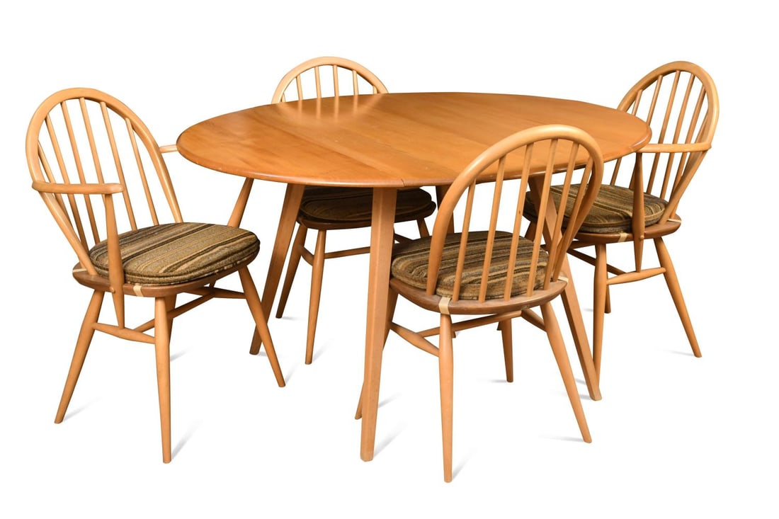 An Ercol elm 'Windsor' drop-flap dining table and four chairs,: An Ercol elm 'Windsor' drop-flap dining table and four chairs, two of the stickback chairs with arms 72 x 65cm - 123 x 113cm