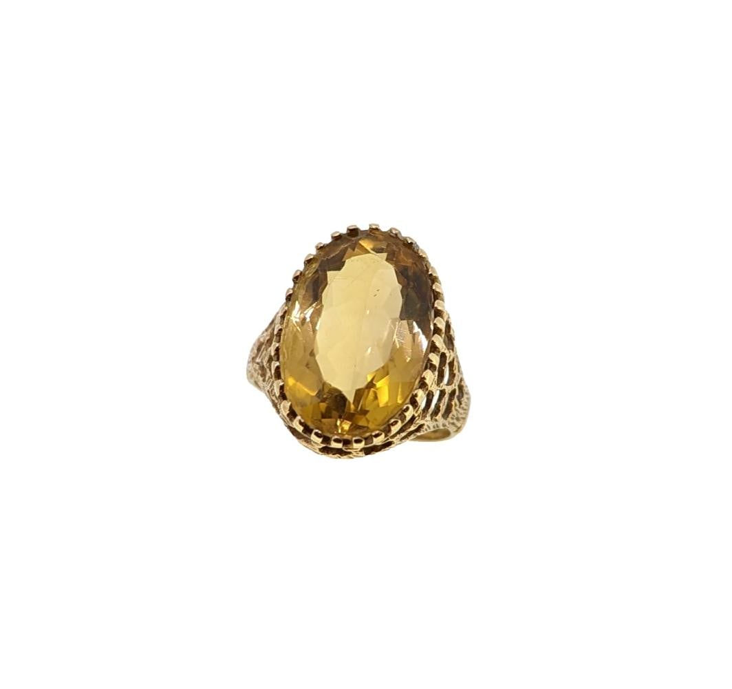 A late 20th century 9ct gold citrine dress ring, (1 of 3)