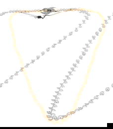 A natural saltwater pearl necklace with a diamond set clasp,