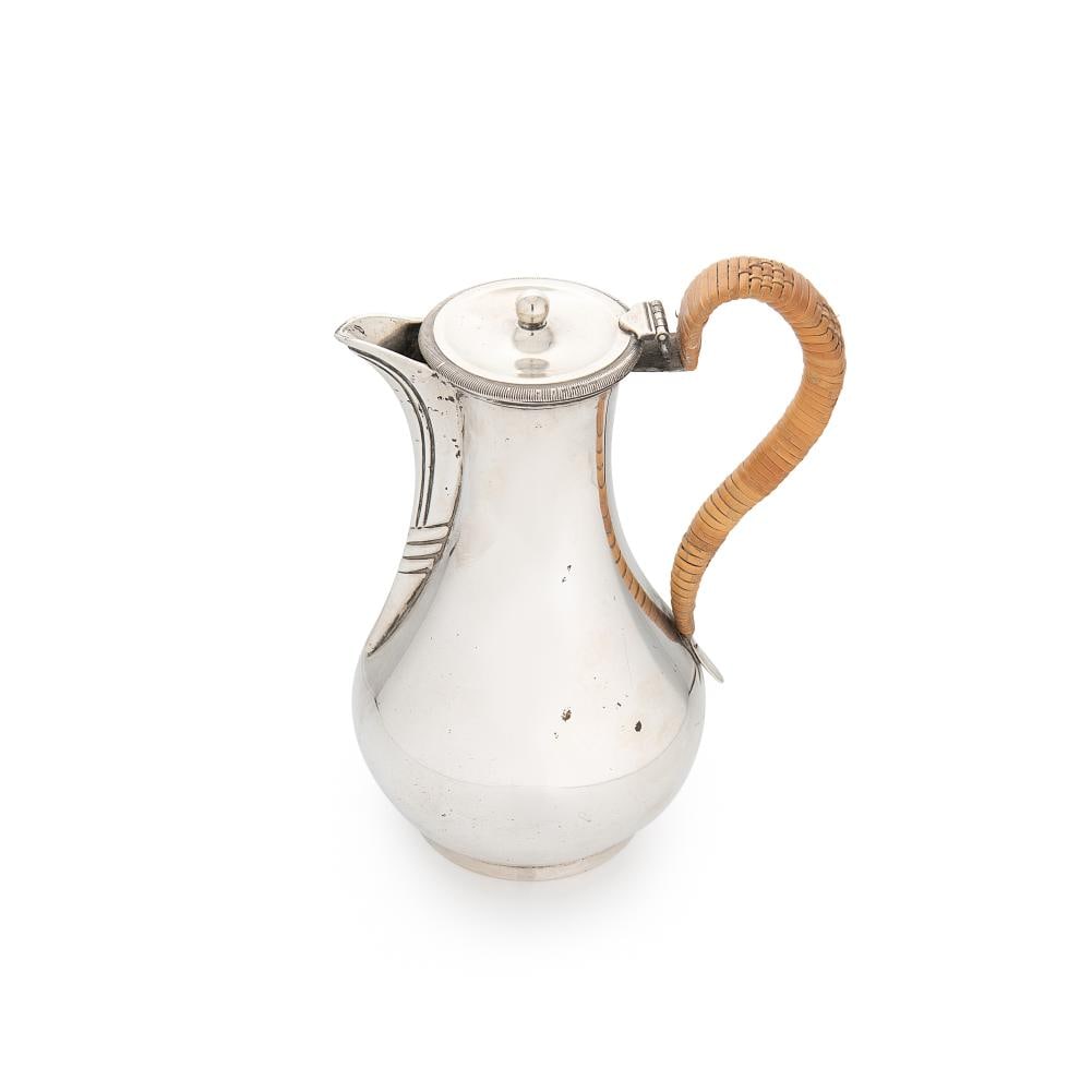 A George V silver hot water jug,: A George V silver hot water jug, mark of William Comyns & Sons Ltd. (Richard Comyns), London 1927, of squat baluster form, part marked piano hinged flat topped cover with milled edge, rattan covered S