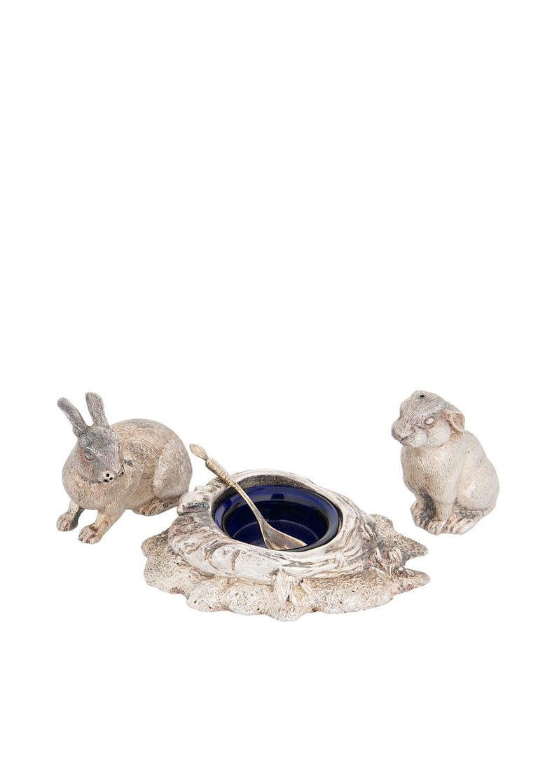 An Elizabeth II silver novelty 3-piece cruet set,: An Elizabeth II silver novelty 3-piece cruet set, mark of William Comyns & Sons Ltd. (Richard Comyns), London 1990, the salt and pepper casters in the form of cast and chased rabbits, the open mustard