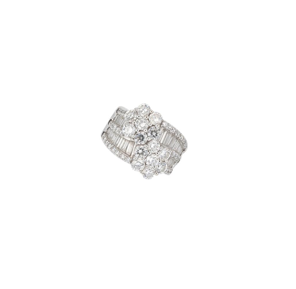 A diamond set double cluster ring,: A diamond set double cluster ring, two daisy style clusters of round brilliant cut diamonds, slightly curved shoulders set with baguette and round brilliant cut diamonds, known stamped total diamond w