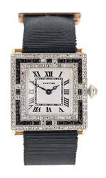 Cartier - An Art Deco French platinum and 18ct gold diamond and onyx set wristwatch,