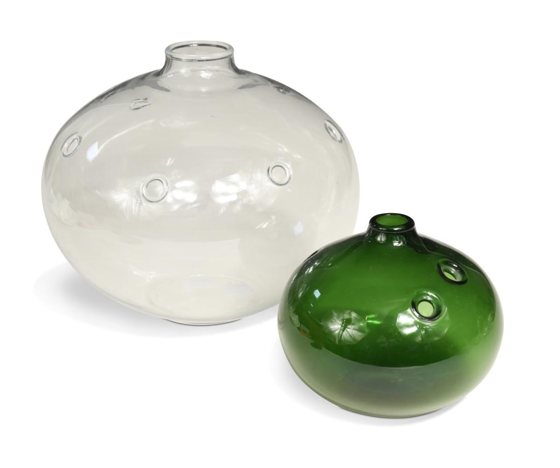 Michael Bang for Holmegaard, two 'Hul' bubble vases, circa 1973,: Michael Bang for Holmegaard, two 'Hul' bubble vases, circa 1973, the larger in clear glass, the smaller in dark green glass, each with a central aperture surrounded by irregularly spaced apertures for