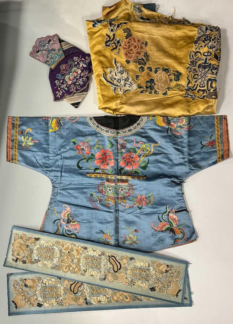 A Chinese child's blue silk embroidered jacket, early 20th century, (1 of 20)