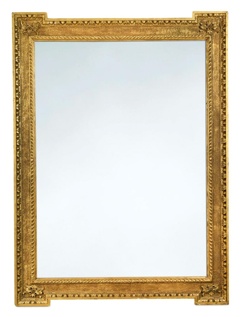 A William Kent style giltwood rectangular wall mirror, 19th century,: A William Kent style giltwood rectangular wall mirror, 19th century, the moulded frame with sand-effect ground and egg and dart moulded edge, the projecting corners with a flower head moulding 121 x 8