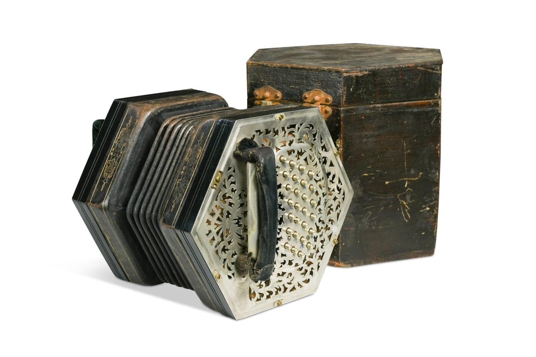 Jeffries Bros., a fifty-eight key Anglo concertina, late 19th or early 20th century,: Jeffries Bros., a fifty-eight key Anglo concertina, late 19th or early 20th century, the hexagonal body with foliate pierced metal ends and six fold bellows, one end engraved 'Jeffries Bros., Maker, 2