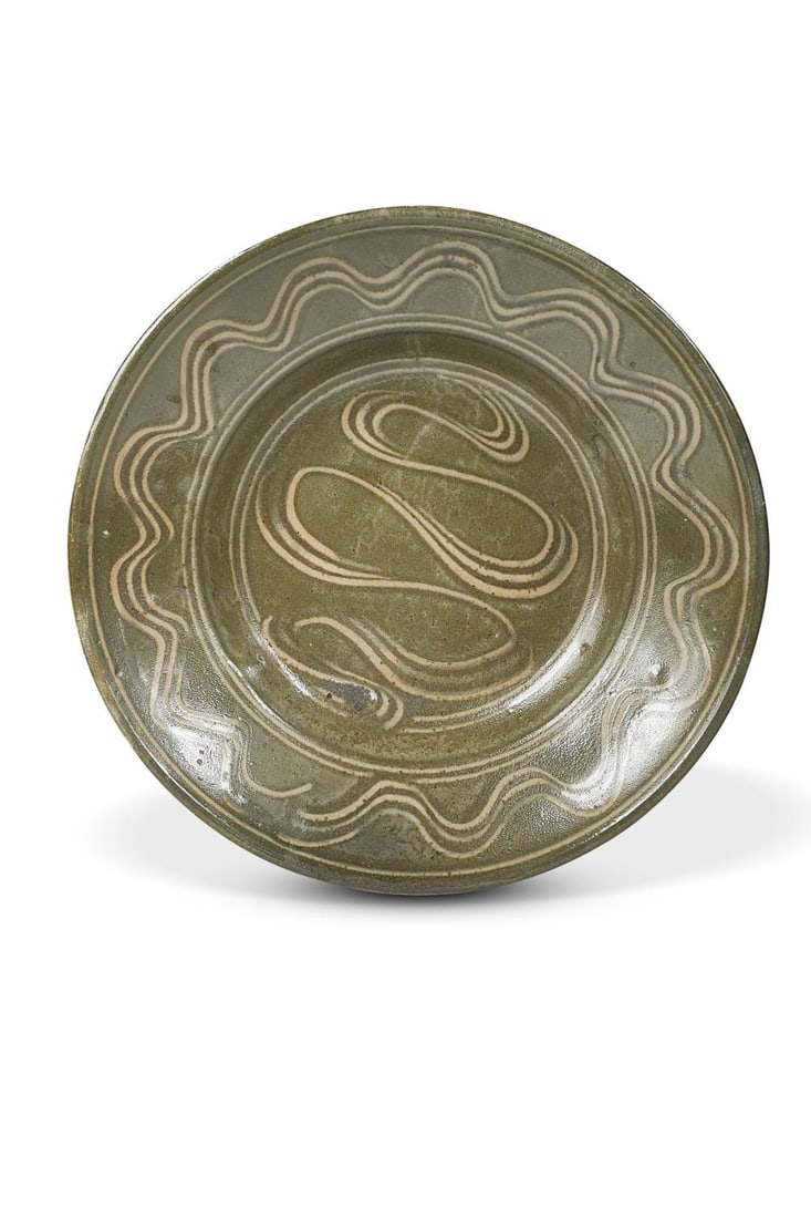 § Michael Cardew (1901-1983) for Wenford Bridge, a large studio pottery dish, circa 1975,: § Michael Cardew (1901-1983) for Wenford Bridge, a large studio pottery dish, circa 1975, with combed decoration to rim and centre over a dark olive ground, impressed seal marks and hand-painted 'P'