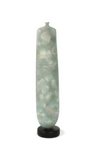 § Peter Hayes (1946-), a narrow bottle-form vase,: § Peter Hayes (1946-), a narrow bottle-form vase, of solid construction, the 'celadon' composition body with ceramic inclusions, mounted to circular plinth base, incised signature to base 49.5cm high