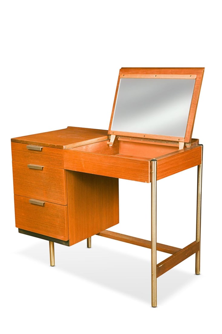 John & Sylvia Reid for Stag Furniture, a mid-century teak desk or dressing table,: John & Sylvia Reid for Stag Furniture, a mid-century teak desk or dressing table, with lift-up top revealing a dressing mirror within, three graduated drawers to the left side on tubular chrome suppor