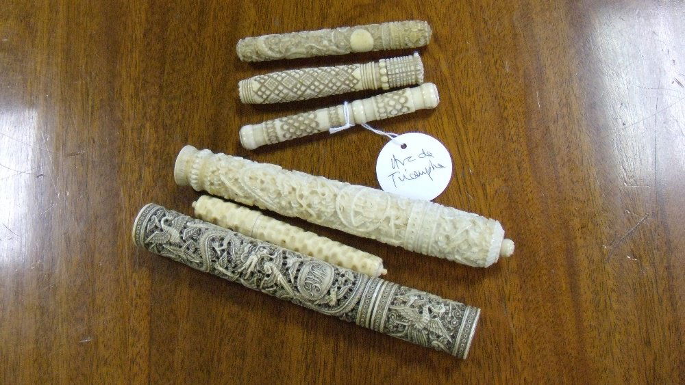 Three 19th century Chinese ivory needle cases and three: Three 19th century Chinese ivory needle cases and three European, the former carved in low relief with dragons amongst clouds, the largest 16cm (6.25 in.) high, the European examples in geometrically