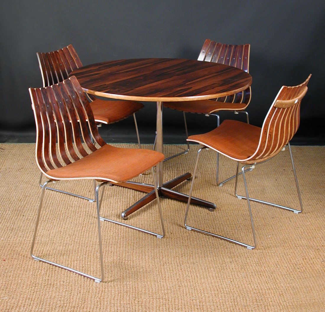 Hans Brattrud (born 1933), A set of four Scandia dining: Hans Brattrud (born 1933), A set of four Scandia dining chairs, design originated 1957, manufactured by Hove Mobler, each rosewood chair with a tapering moulded ribbed body, raised on a chrome frame,
