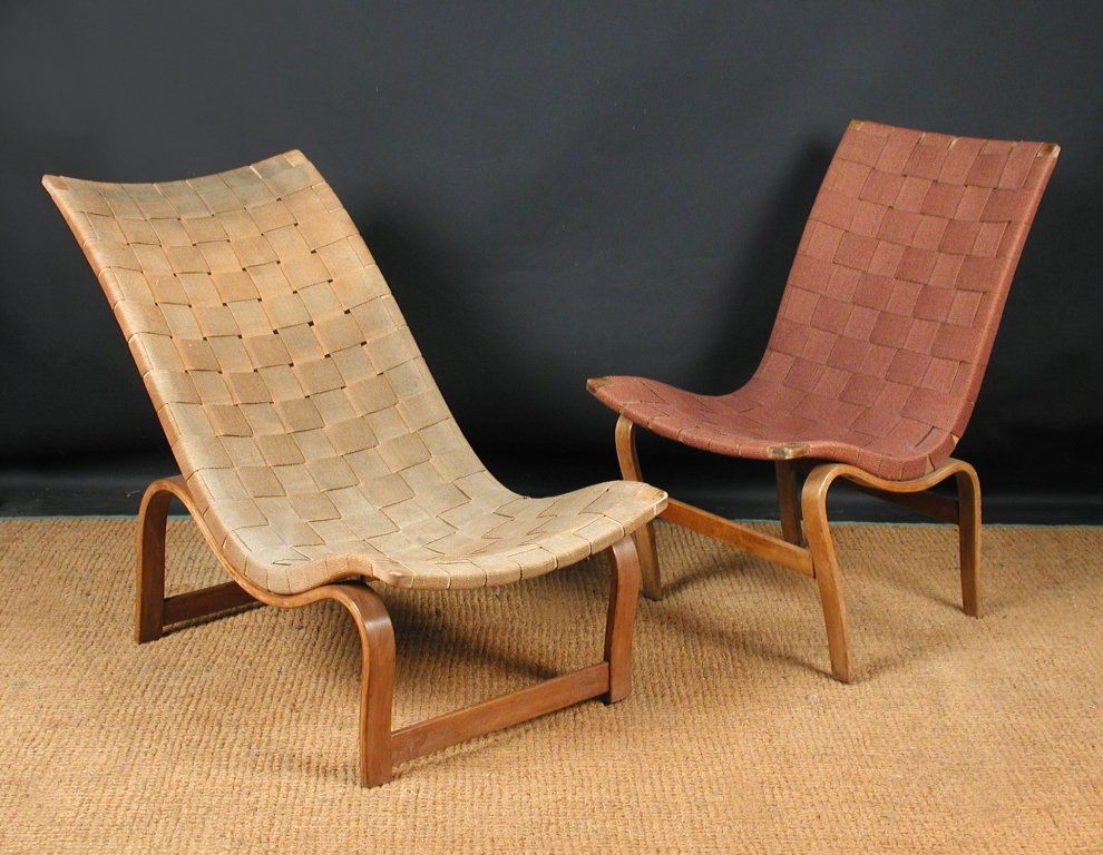 Bruno Mathsson, a laminated beech and canvas webbed 'Ev: Bruno Mathsson, a laminated beech and canvas webbed 'Eva' lounge chair, designed 1934, with paper label to the underside 84cm (33in)