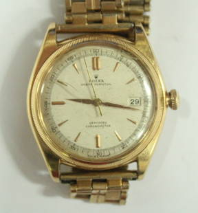 Rolex - a gentleman's gold oyster perpetual certified: Rolex - a gentleman's gold oyster perpetual certified chronometer wristwatch, the silvered dial with centre seconds, date aperture, case number 598163, movement number 53468, with time keeping