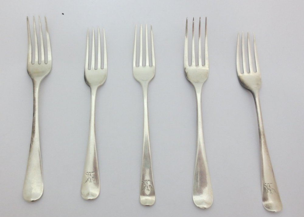 A matched set of twelve silver Old English pattern: A matched set of twelve silver Old English pattern dessert forks, including five China trade examples by Cutshing, 2nd quarter of 19th century and seven others, various dates and makers, 14.88oz (12)