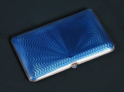 A Russian silver gilt and blue enamel cigarette case,: A Russian silver gilt and blue enamel cigarette case, Kokoshnik mark for St Petersburg, 1908-1917 and with London import marks for 1910, of rectangular shape all over decorated in blue bassetaille ena