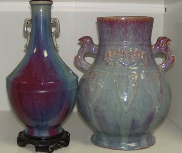 Two 19th century flambe vases,: Two 19th century flambe vases, both with turquoise and mauve streaky glazes, one of flattened baluster shape moulded with daodieh lappets and applied with bird's head handles on the shoulders, 29cm (1