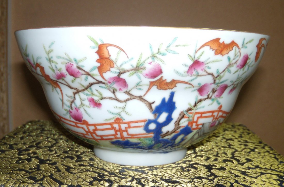 A famille rose bowl, seal mark of Daoguang,: A famille rose bowl, seal mark of Daoguang, the ogee sides of the exterior painted with a peach tree fruiting by an iron red fence and with Buddhist objects, the interior turquoise, mark in red, 15cm 
