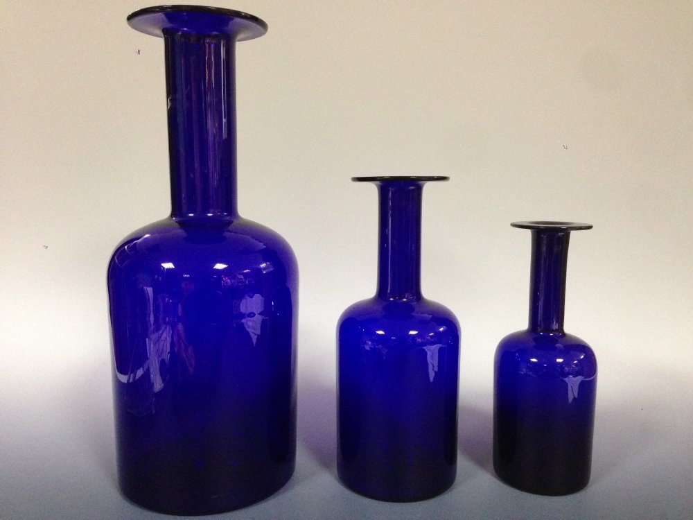 A graduated set of three Holmegaard Gul vases,: A graduated set of three Holmegaard Gul vases, originally designed by Otto Brauer, each in cobalt blue, the largest 44cm (17.5in) high (3)