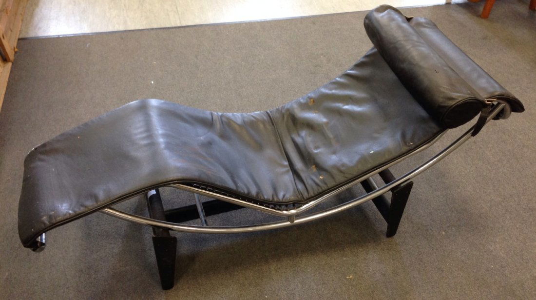 After Le Corbusier, an LC4 (B306) Chaise Longue,: After Le Corbusier, an LC4 (B306) Chaise Longue, upholstered in black leather with tubular chrome frame, the frame stamped LC4 14926