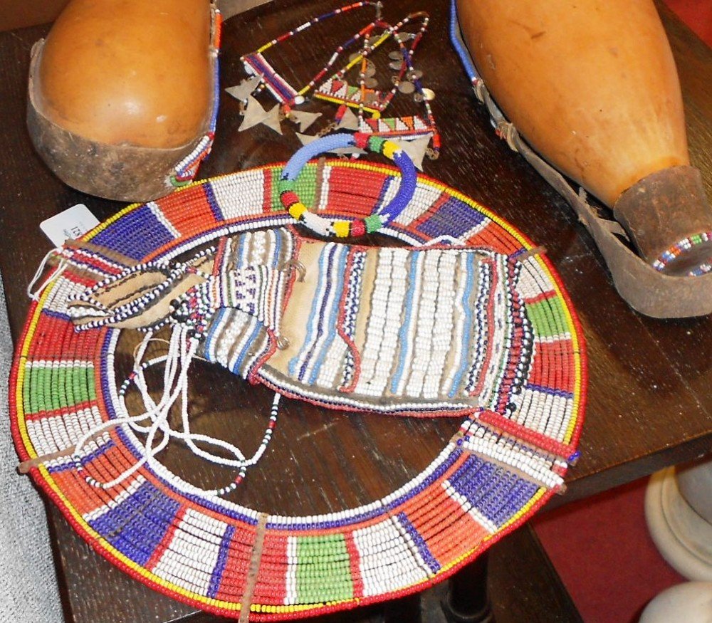 A Masai tribal beadwork collar,: A Masai tribal beadwork collar, two water carriers and other beadwork tribal pieces (a collection)