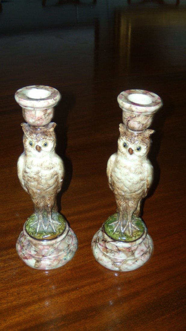 Jerome Massier, Vallauris, a pair of faience owl: Jerome Massier, Vallauris, a pair of faience owl candlesticks, the open eyed birds standing on marbled socle feet with urn shaped nozzles on their heads, JM and Vallauris marks in black, 24cm (9.5 in)