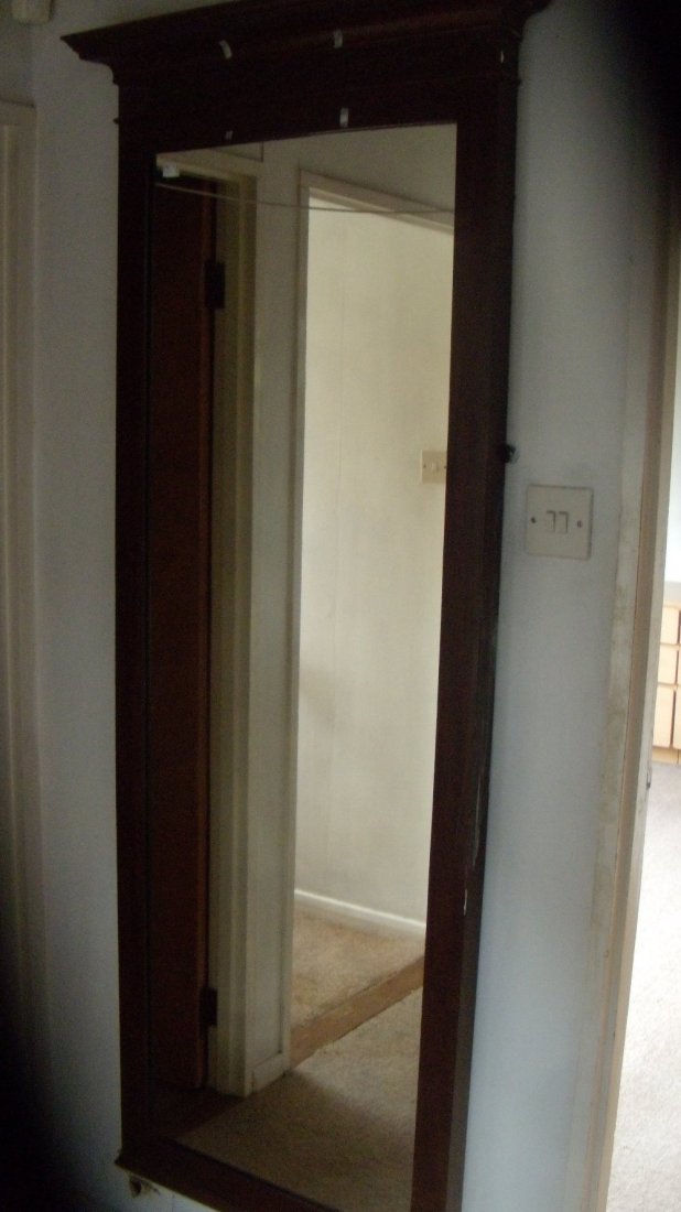 An Edwardian mahogany framed full length mirror,: An Edwardian mahogany framed full length mirror, the dentil band to the cornice above blind fret guilloche, 176 x 71cm (69.25 x 28 in)