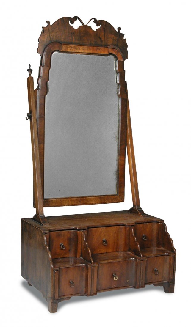 An 18th century walnut dressing table mirror,: An 18th century walnut dressing table mirror, with fret carved cresting and tiered drawers, 89cm high x 43cm wide 89 x 43 x 26cm (35 x 17 x 10in)