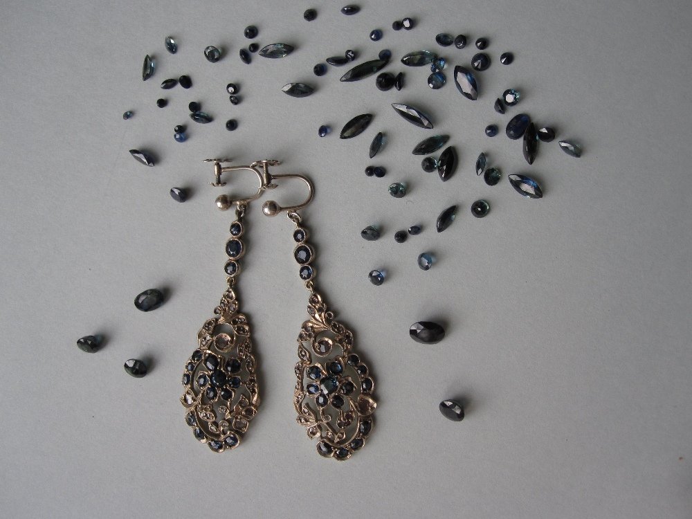 A pair of sapphire and diamond earpendants together: A pair of sapphire and diamond earpendants together with a quantity of loose sapphires, each screw-back earring designed as a line of three collet set sapphires suspending a pierced oval convex plaque
