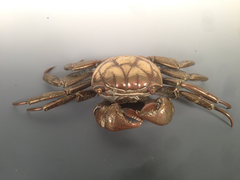 An articulated brass model of a crab,: An articulated brass model of a crab, the details of the shell and claws hand finished, 22cm (8.75 in) wide