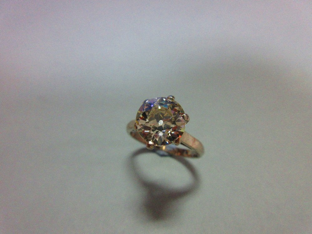 An impressive single stone diamond ring, (1 of 8)