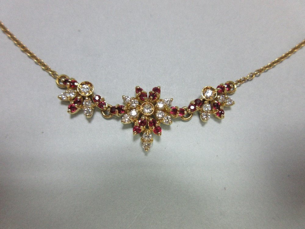 An 18ct gold ruby and diamond necklace, (1 of 5)