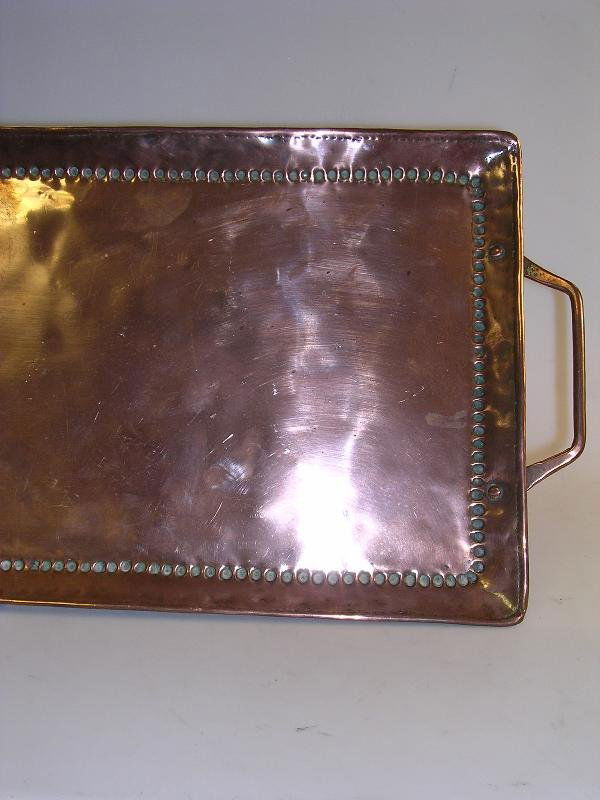 A large cooper tray by John Pearson: A large cooper tray by John Pearson of rectangular form with beaded decoration and handles to each end impressed stamp 65.5cm long