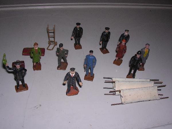 Britains for Bassett Lowke O Gauge platform staff: Britains for Bassett Lowke O Gauge platform staff and passengers including station master, 2 guards, mechanic, policeman, porter with luggage barrow, 2 female passengers, golfer and 2 naval ratings