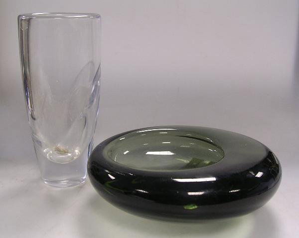 AN OREFORS VASE AND A HOLMEGAARD BOWL: An Orrefors glass vase, of tapered cylindrical form, Together with a Holmegaard green glass bowl, etched marks to both, the vase 18cm high