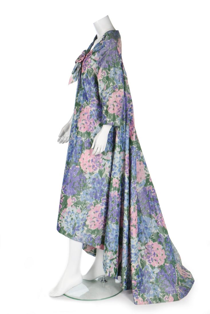 A Jacques Griffe couture chiné taffeta tent coat, circa: Description: A Jacques Griffe couture chiné taffeta tent coat, circa 1957, labelled and numbered 509285, printed with hydrangeas in shades of pink and blue, the hem falling longer to the rear, bust a