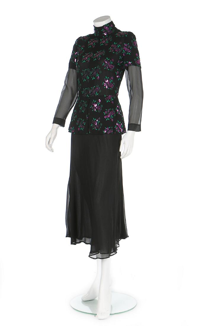 A Thea Porter embellished black chiffon dress, circa: Description: A Thea Porter embellished black chiffon dress, circa 1979, labelled and size 10, the bodice with peplum and purple sequinned flowers, bust approx 87cm, 34in Condition Report: Good conditi