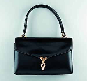 An Hermès black leather handbag, circa 1960-70, sta: An Hermès black leather handbag, circa 1960-70, stamped to the interior Hermès, Paris, lined in softest kid, gilt brass rope-twist clasp clasp, 24.5cm, 9 1/2in