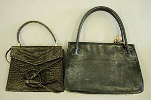 A René Mancini chocolate crocodile handbag, late 19: A René Mancini chocolate crocodile handbag, late 1960s, stamped in gold to the interior René Mancini, Paris, with dark brown leather lining, detachable shoulder strap, 23cm, 9in long, together with