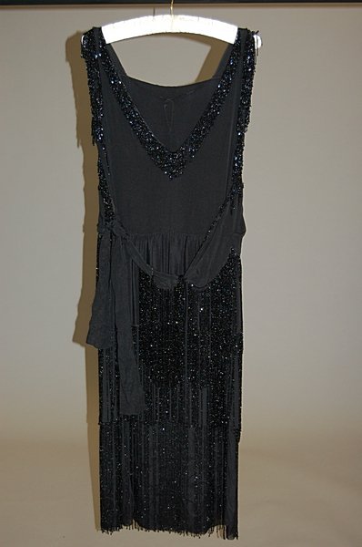 A beaded and fringed flapper dress, circa 1925, o