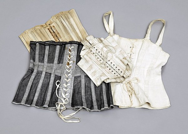 Four interesting corsets, comprising: a grey calico