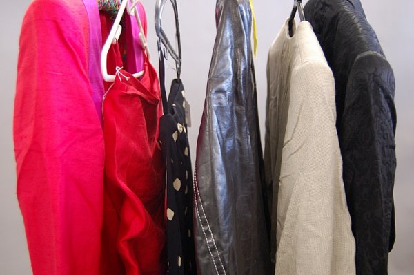 A group of 1980s designer-wear, comprising: Armani: A group of 1980s designer-wear, comprising: Armani trouser suit with padded shoulders, Claude Montana red and fuchsia suit; DKNY separates including a black leather coat, (qty