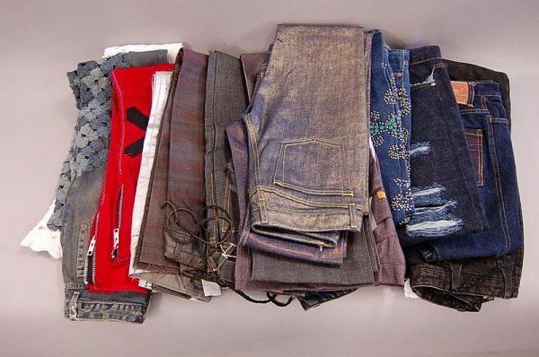 A group of jeans and casual trousers, including: E: A group of jeans and casual trousers, including: Evisu; DKNY; Levi's, covered in metal studs and coloured diamante; Agatha New York and others, waist 26in 66cm to 32in 81cm, (16)
